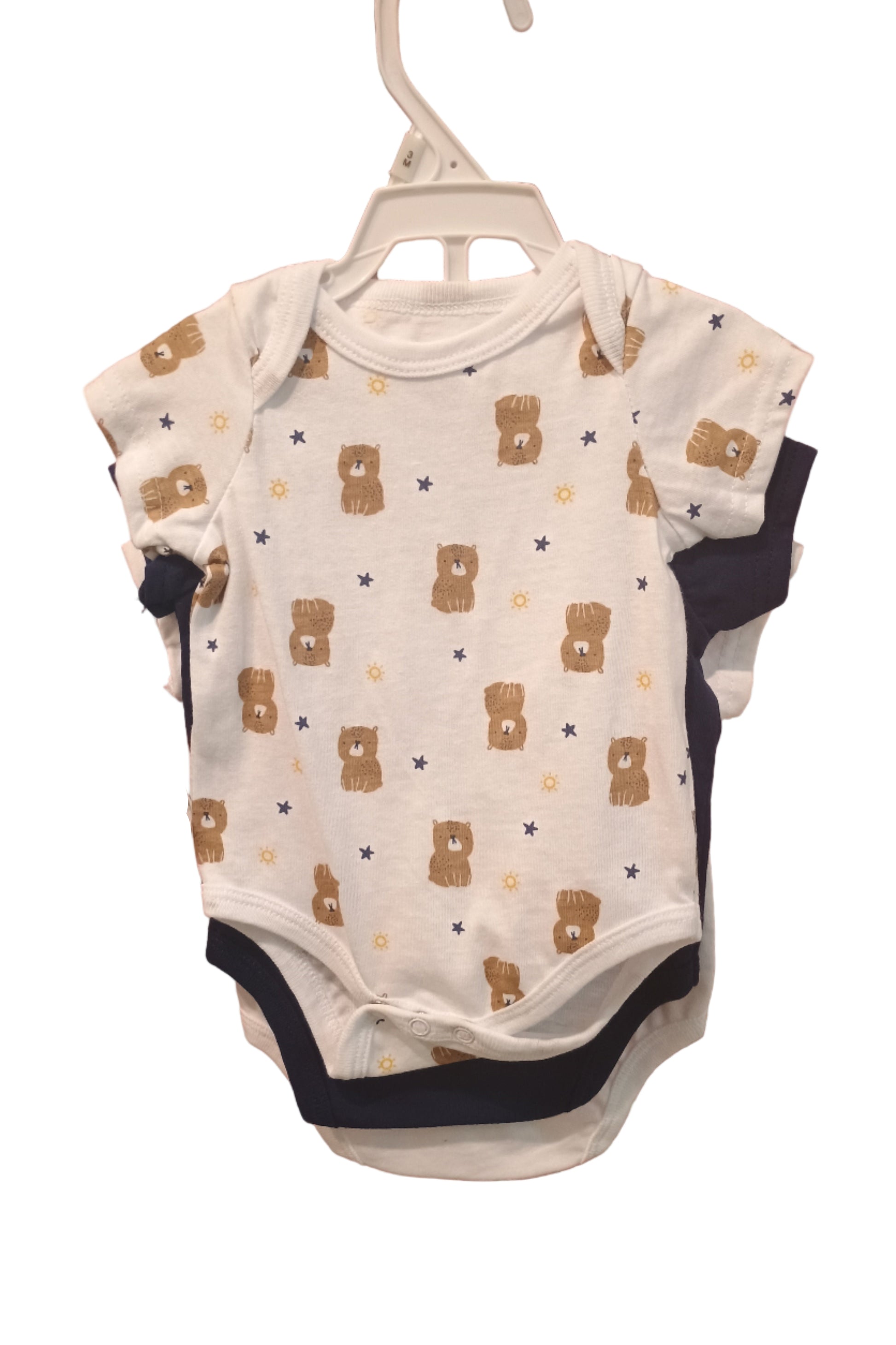 Baby onesie with bear pattern on a white surface