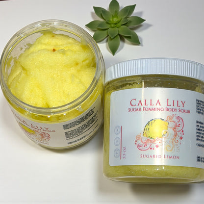 Jar of Calla Lily Sugar Foaming Body Scrub with a succulent plant on a white background