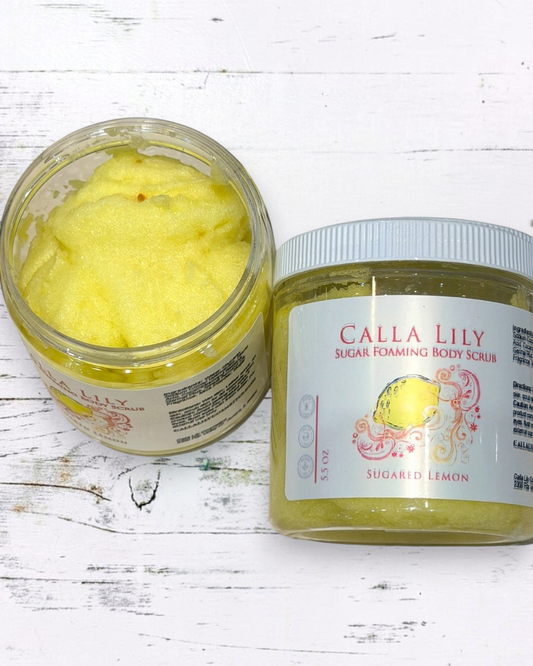 Jar of Calla Lily Sugar Foaming Body Scrub with a succulent plant on a white background
