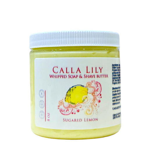 Jar of Calla Lily whipped soap and shave butter on a wooden surface