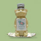 Bear-shaped honey container with 'Calla Lily' label on a green background
