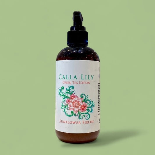 Bottle of Calla Lily Green Tea Lotion with decorative label on a green background