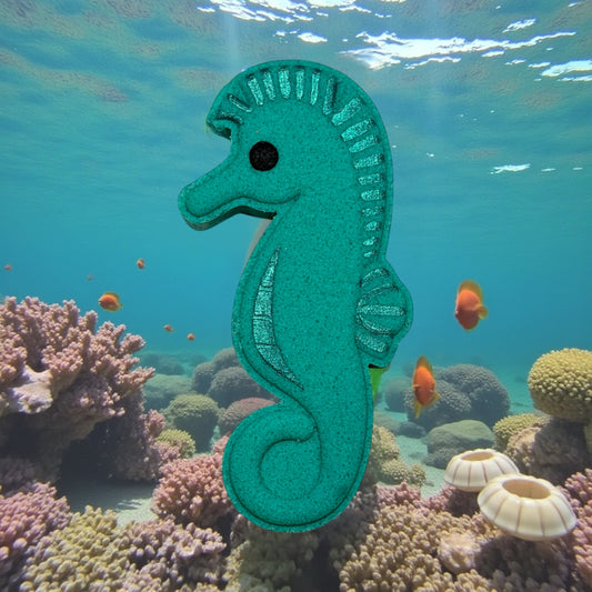 Green seahorse toy in an underwater scene with coral and fish
