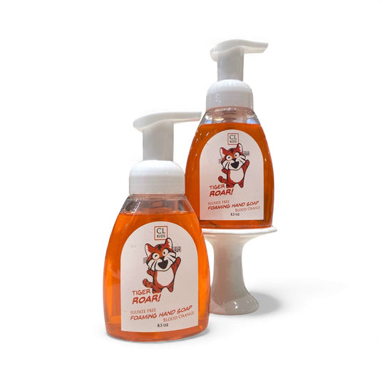 Two bottles of 'Tiger Roar!' foaming hand soap on a white background