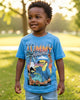 Child wearing a Tommy Bahama shirt in a park setting