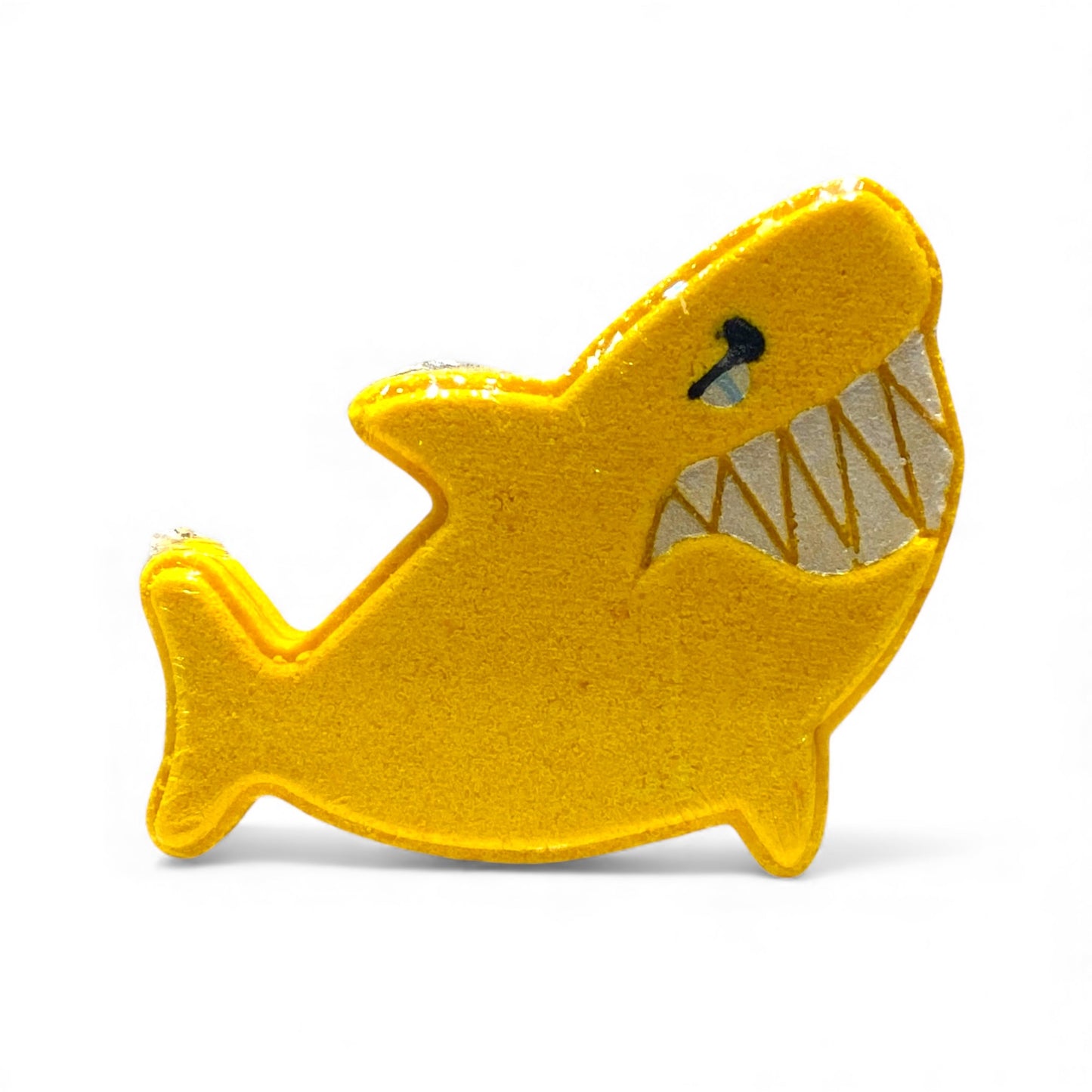 Yellow shark-shaped toy on a white background