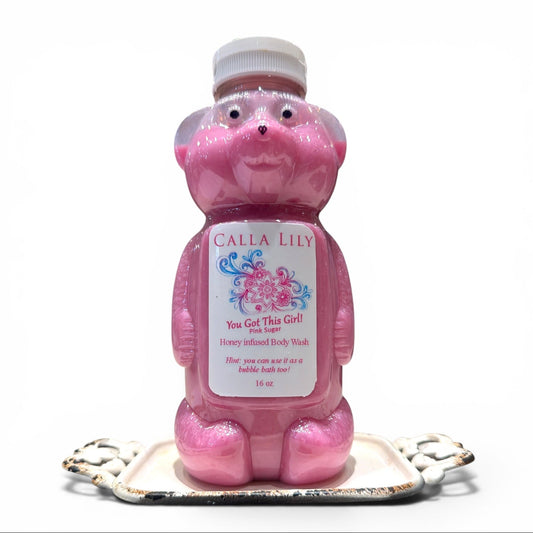 Pink bear-shaped bottle of Calla Lily body wash on a white background