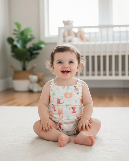Baby romper with animal pattern on a white background