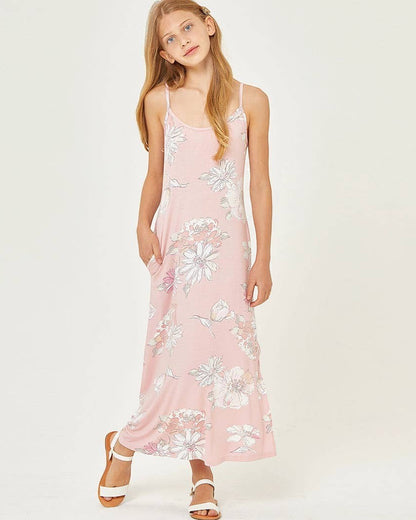 Woman wearing a pink floral dress on a white background