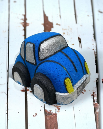 Calla Lily Cosmetics + CL kids blue Volkswagen Bug-shaped bath bomb with blueberry scent and nourishing ingredients.
