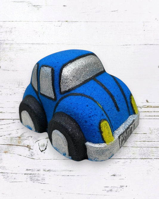 Calla Lily Cosmetics + CL kids blue Volkswagen Bug-shaped bath bomb with blueberry scent and nourishing ingredients.