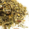 Close-up of a mix of dried herbs and leaves on a white background