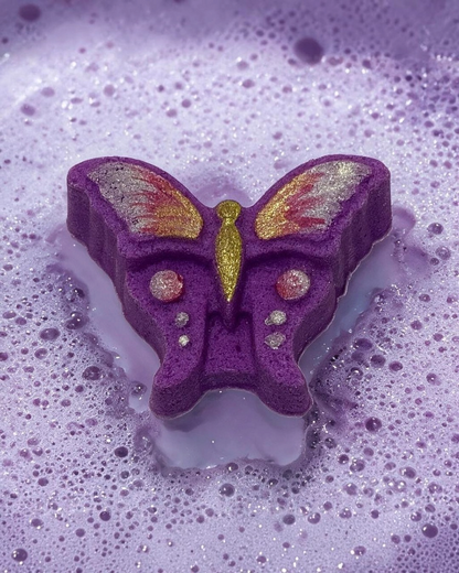 Calla Lily Cosmetics + CL kids purple butterfly bath bomb fizzing in water with grape soda scent