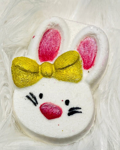 Calla Lily Cosmetics + CL kids white bunny bath bomb with pink ears and a gold glitter bow for kids bath time