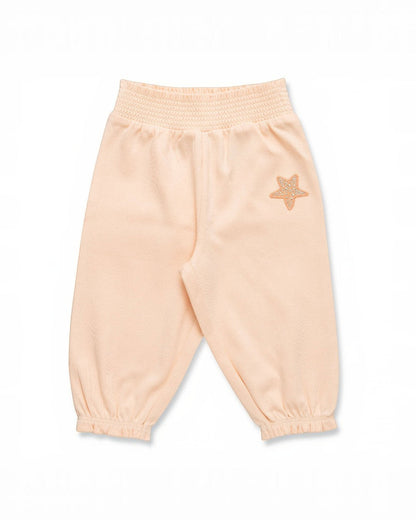 Light pink sweatpants with a star design on a white background