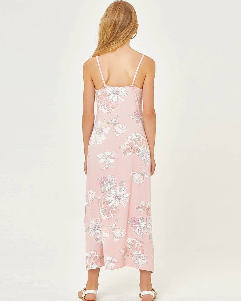 Woman wearing a pink floral dress on a white background