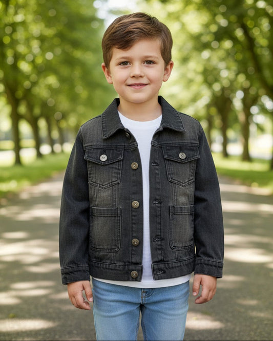 Toddler wearing a black acid wash denim jacket from Calla Lily Cosmetics + CL kids in a park setting.