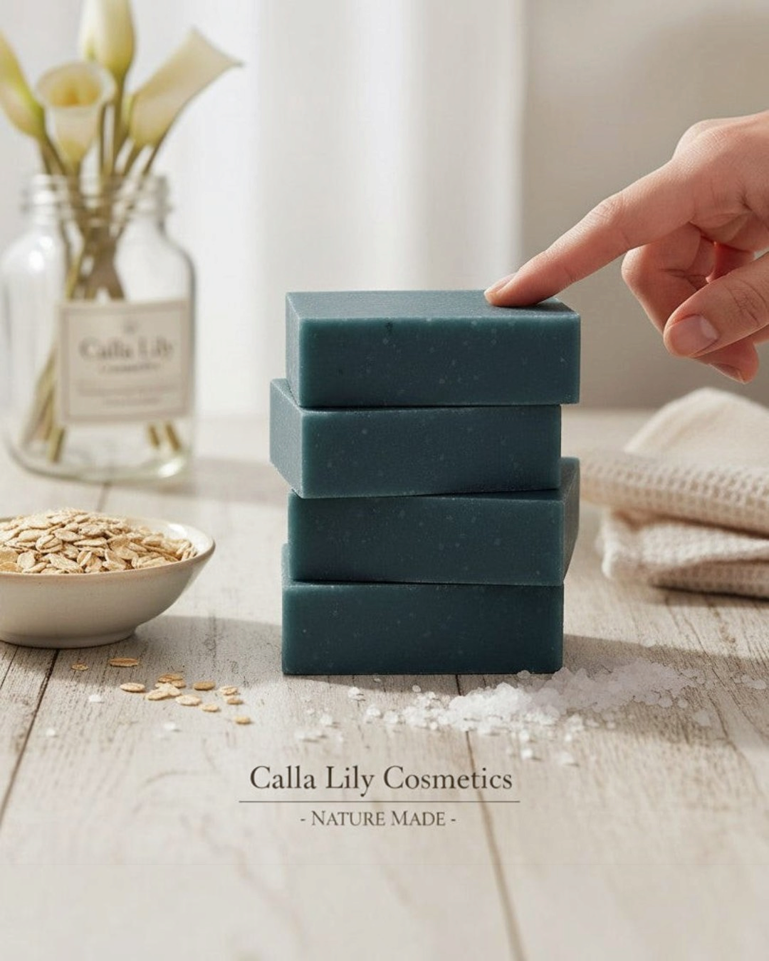 Calla Lily Cosmetics Blueberry Scrub Bar Soap with activated charcoal, oatmeal, and sea salt for exfoliation. Deep blue color.