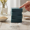 Calla Lily Cosmetics Blueberry Scrub Bar Soap with activated charcoal, oatmeal, and sea salt for exfoliation. Deep blue color.