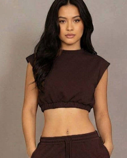Calla Lily Cosmetics brown cotton French terry crop top with elastic hem and wide-leg pants.