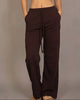 Calla Lily Cosmetics brown cotton French terry crop top with cap sleeves and elastic hem, paired with wide-leg pants.