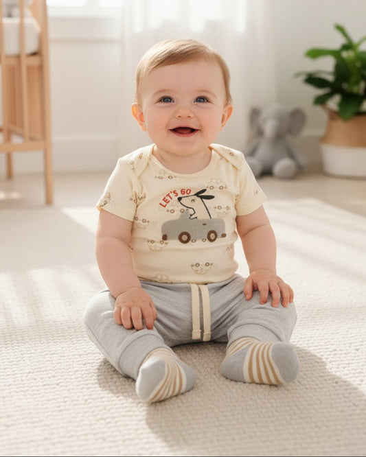 Calla Lily Cosmetics + CL kids baby 3-piece set: pale yellow bodysuit with car applique, grey pants, and striped socks. Cotton-polyester blend.