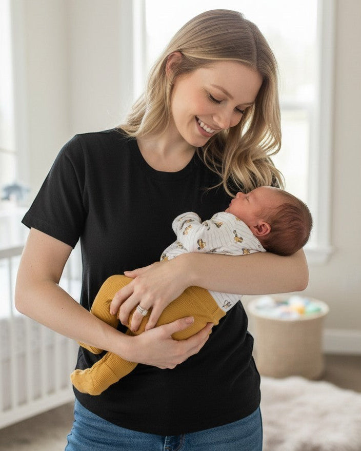 Calla Lily Cosmetics + CL kids baby boys white long-sleeve bodysuit with construction truck print and mustard yellow pants. Cotton-polyester blend.