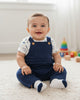 Calla Lily Cosmetics + CL kids navy blue baby jumper set with white puppy print bodysuit and socks. 60% polyester, 40% cotton.