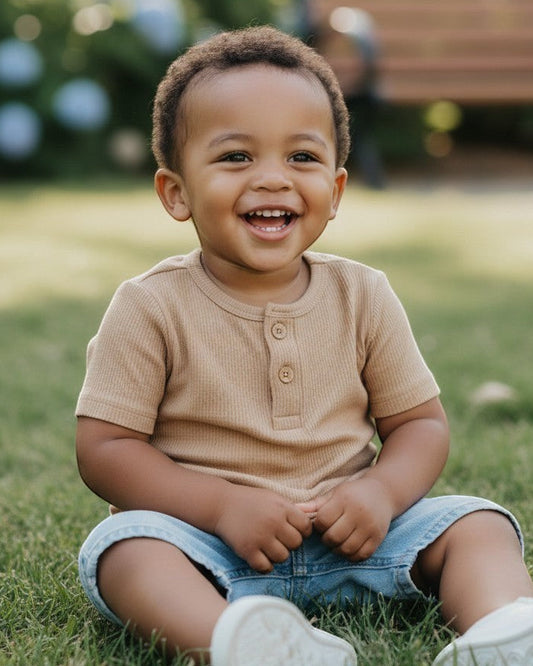 Calla Lily Cosmetics + CL kids three ribbed baby tees in blue, taupe, and white with button details.