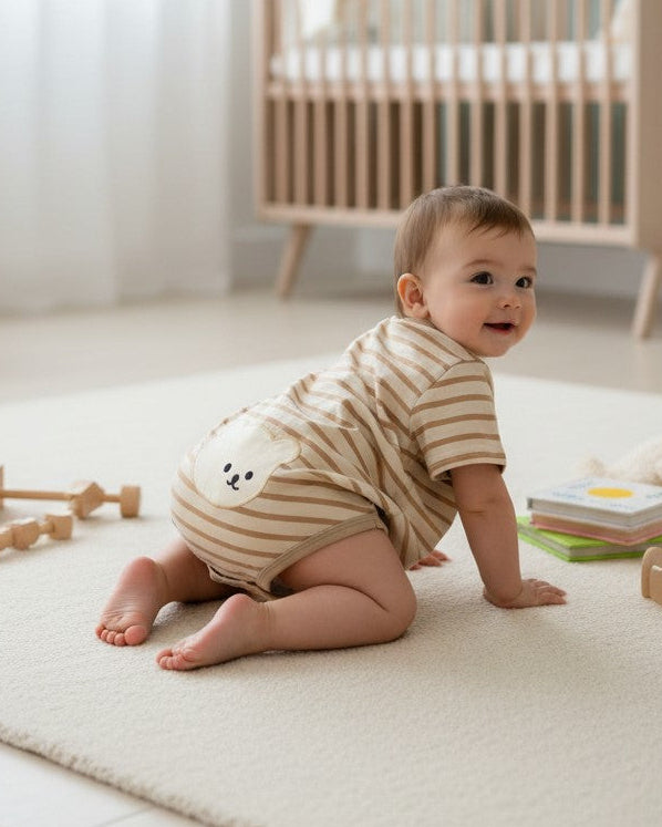 Calla Lily Cosmetics + CL kids baby romper with bear design, brown and tan stripes, oversized fit, short sleeves, cotton-spandex blend.