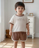 Calla Lily Cosmetics + CL kids cream waffle knit t-shirt with bear embroidery and brown shorts with cream trim.