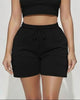 Calla Lily Cosmetics + CL kids black cotton crop tee and drawstring shorts set. Model is 5'7" wearing size S.