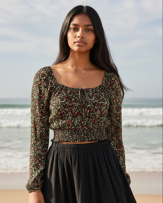 Calla Lily Cosmetics + CL kids black floral long sleeve peasant crop top with smocked hem and tie front on a beach