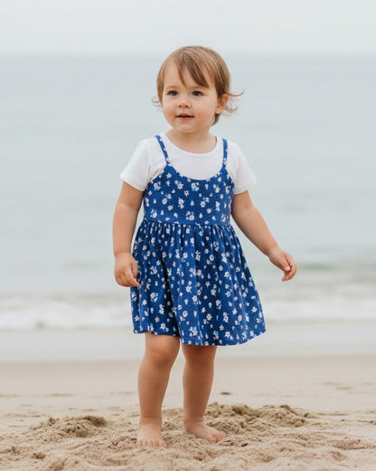 Calla Lily Cosmetics + CL kids blue floral cotton toddler dress with white short-sleeve tee underneath.