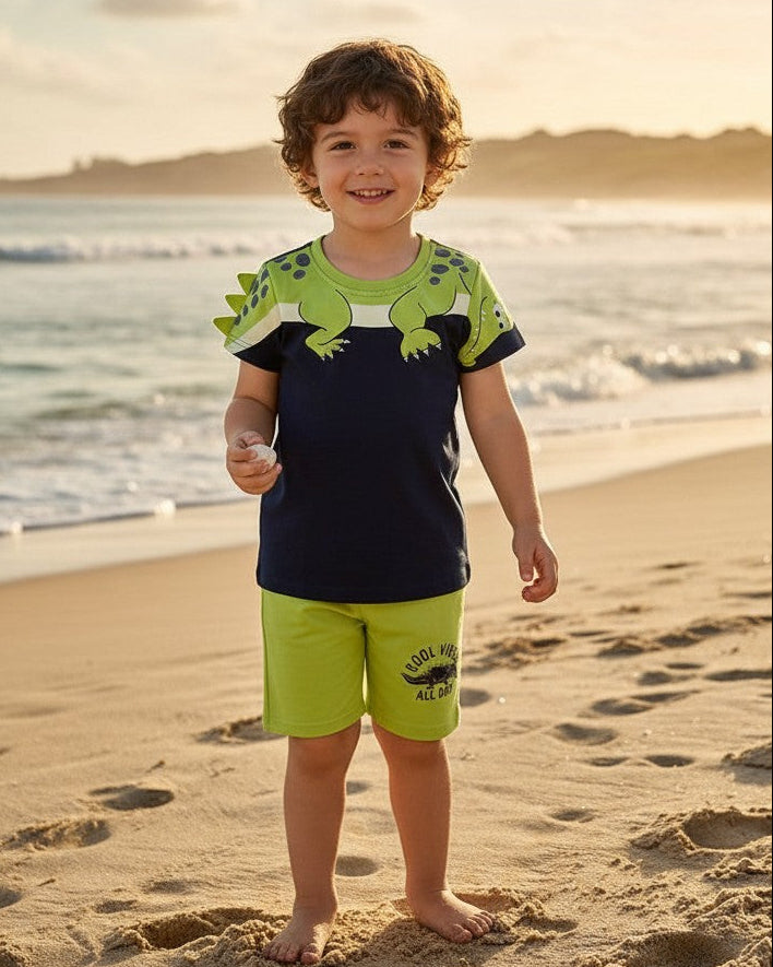 Calla Lily Cosmetics + CL kids blue cotton t-shirt with green dinosaur graphic and matching green shorts with "Cool Vibes All Day" print.