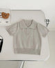 Calla Lily Cosmetics + CL kids light beige knit polo sweater for boys with short sleeves and ribbed texture.