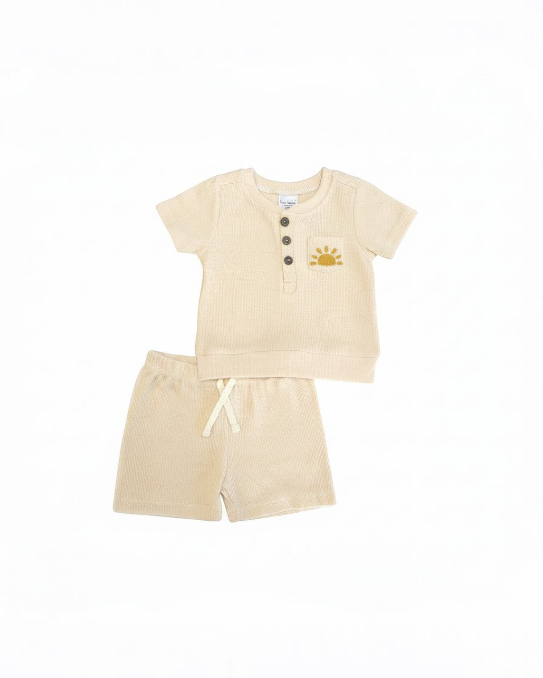 Calla Lily Cosmetics + CL kids cream waffle knit top with sun embroidery and matching shorts. Cotton-polyester blend.