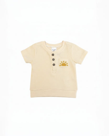 Calla Lily Cosmetics + CL kids cream waffle knit top with sun embroidery and button front, paired with matching shorts.
