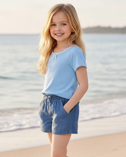Calla Lily Cosmetics + CL kids chambray shorts in denim blue, featuring a drawstring waist and pockets. Made of 100% polyester.