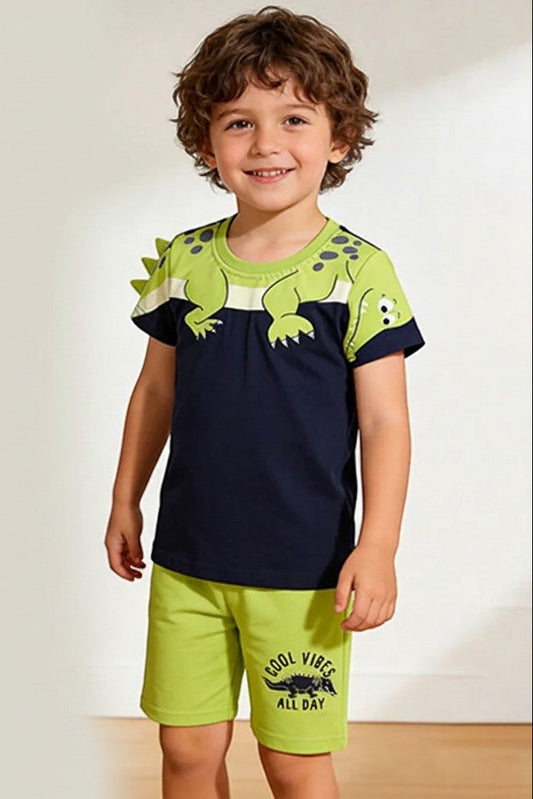 Calla Lily Cosmetics + CL kids two-piece cotton shorts set with dinosaur graphic on white and navy shirts.