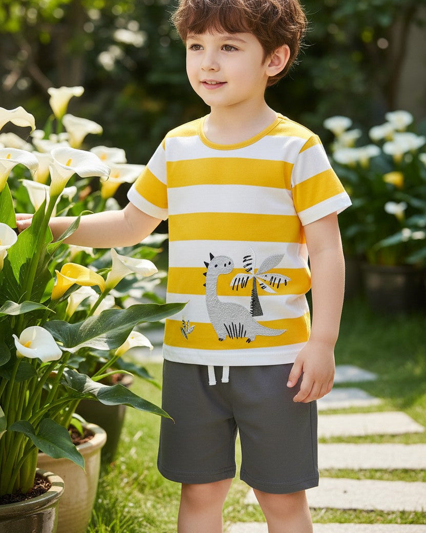 Calla Lily Cosmetics + CL kids yellow and white striped cotton t-shirt with grey dinosaur graphic and grey shorts.