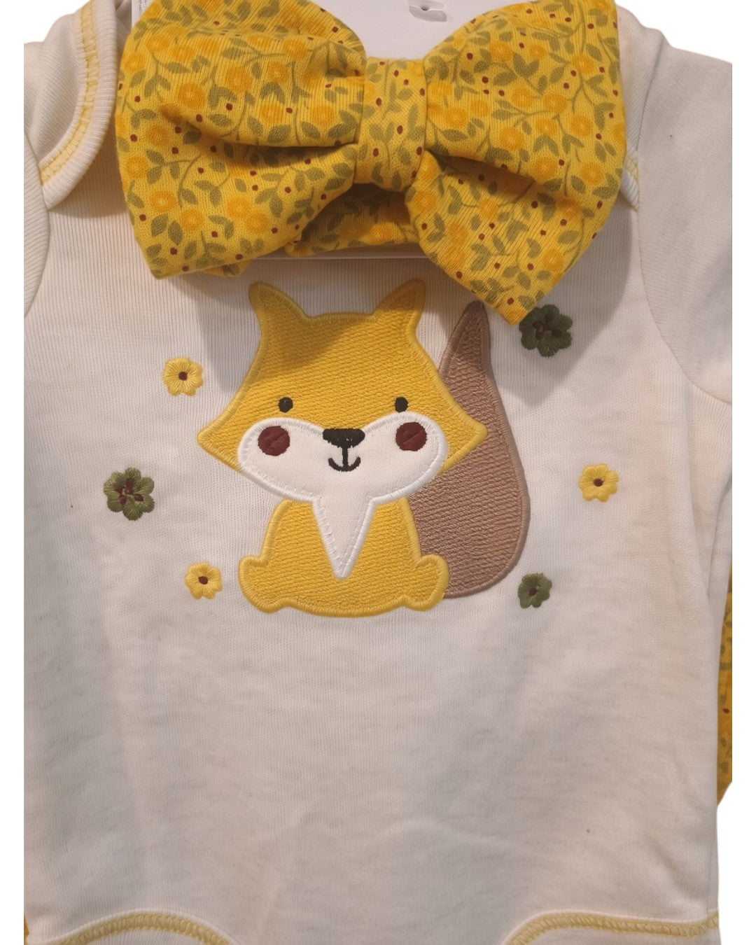 Calla Lily Cosmetics + CL kids white cotton-blend baby onesie with fox applique, yellow floral headband and matching pants. 60% Cotton, 40% Polyester.