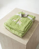 Calla Lily Cosmetics + CL kids green popcorn plush baby blanket with giraffe embroidery. Soft polyester.