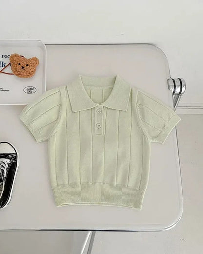Calla Lily Cosmetics + CL kids light green knit polo sweater with short sleeves and button closure.