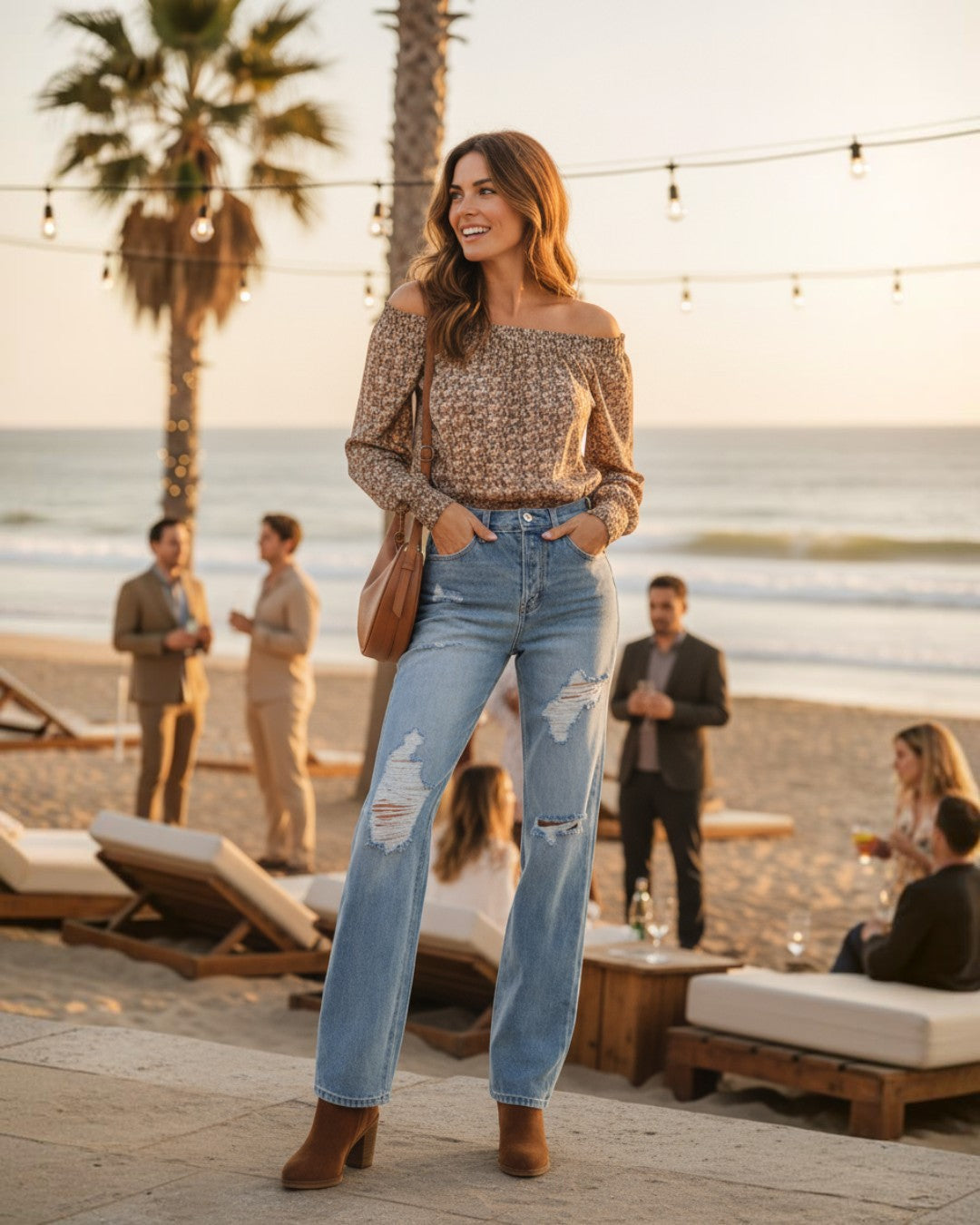 Woman wearing Calla Lily Cosmetics + CL kids Kan Can high-waist distressed straight leg jeans on a beach at sunset.
