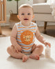 Calla Lily Cosmetics + CL kids organic cotton sleeveless baby romper with orange and blue stripes and a lion applique.