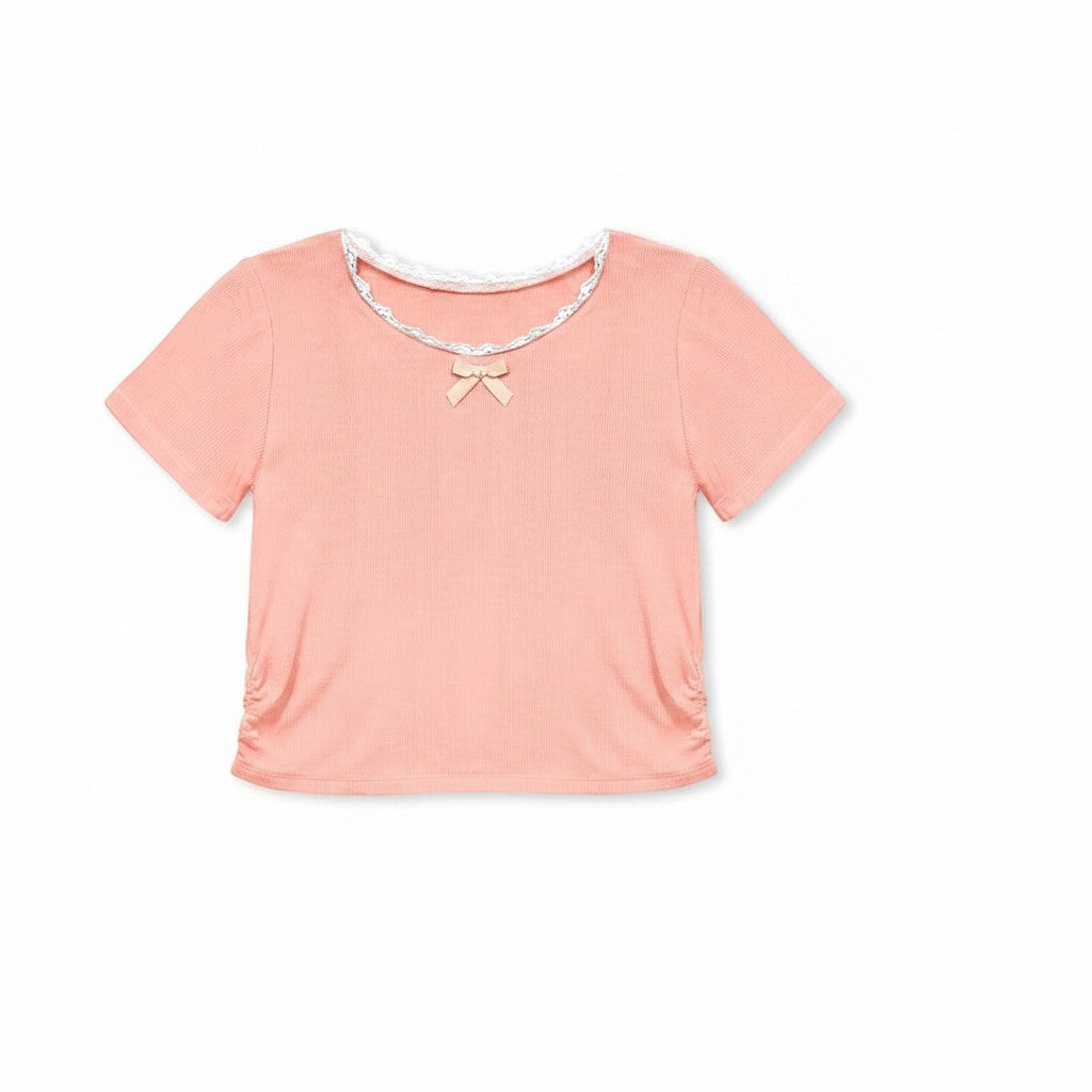 Calla Lily Cosmetics + CL kids toddler peach ribbed knit top with lace trim and bow, paired with blue chambray shorts.