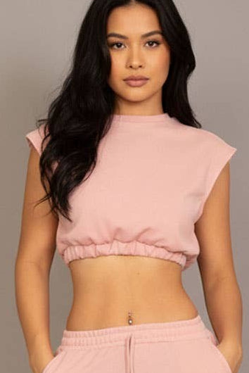 Calla Lily Cosmetics + CL kids pink cotton French terry crop top with elastic hem and wide-leg pants.
