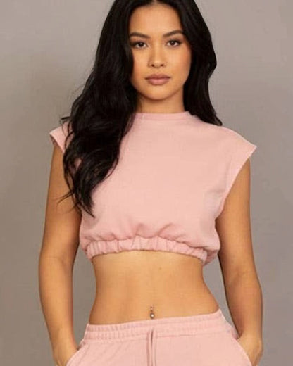 Calla Lily Cosmetics + CL kids pink cotton French terry crop top with elastic hem and wide-leg pants.