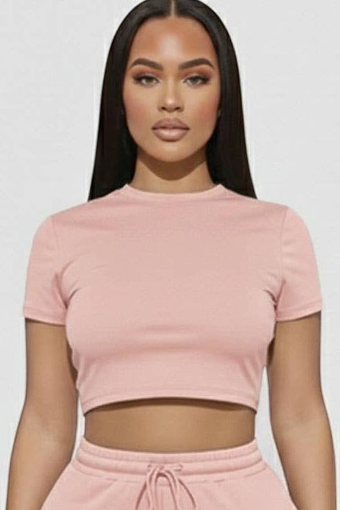 Calla Lily Cosmetics + CL kids pink cotton blend crop tee and drawstring shorts set on a model.